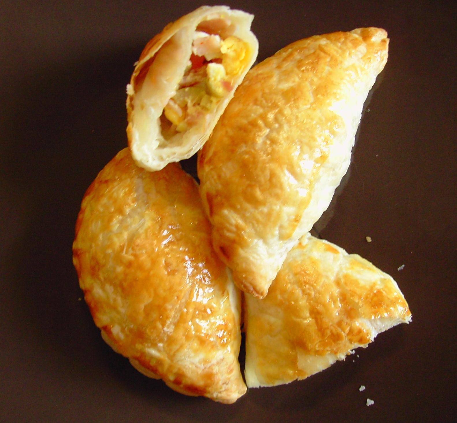  Bite into a warm, flaky empanada filled with savory ham and cheese!