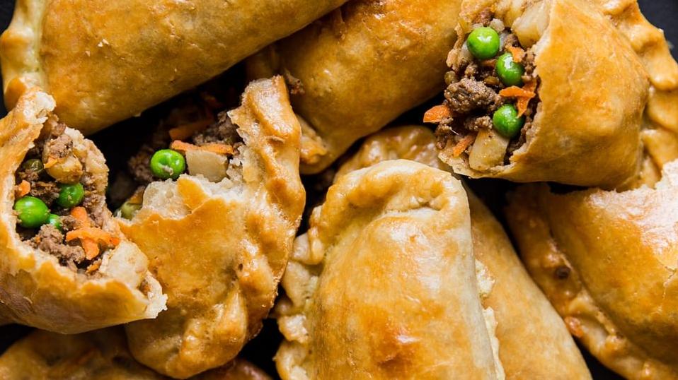  Bite into a warm, freshly-baked empanada and feel the burst of savory goodness in your mouth!