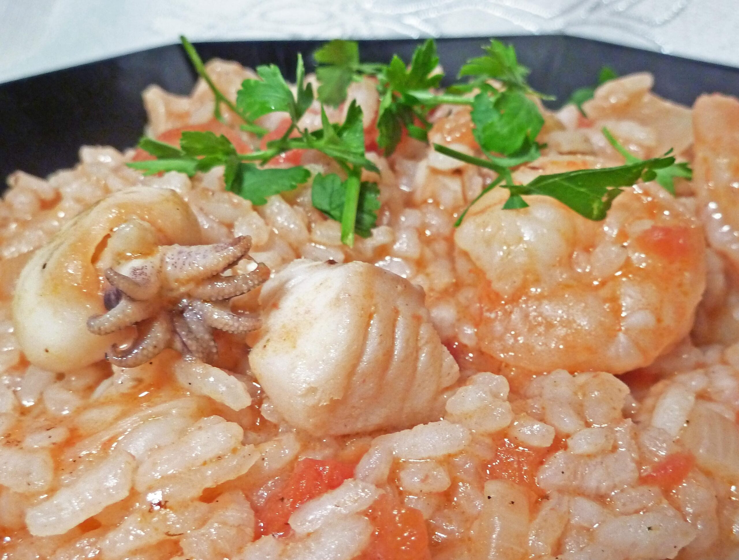  Bring the taste of Portugal into your kitchen with this seafood rice dish.