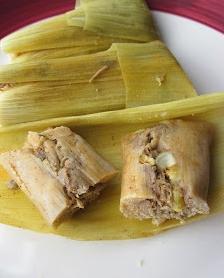  Drizzling sour cream over the cooked and ready-to-serve tamales