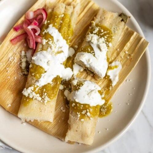 Each tamale is packed with juicy shrimp, gooey cheese, and diced poblano chiles.