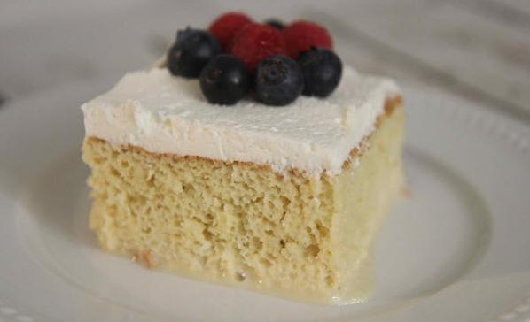  Milk-infused sponge cake, topped with whipped cream and fresh berries