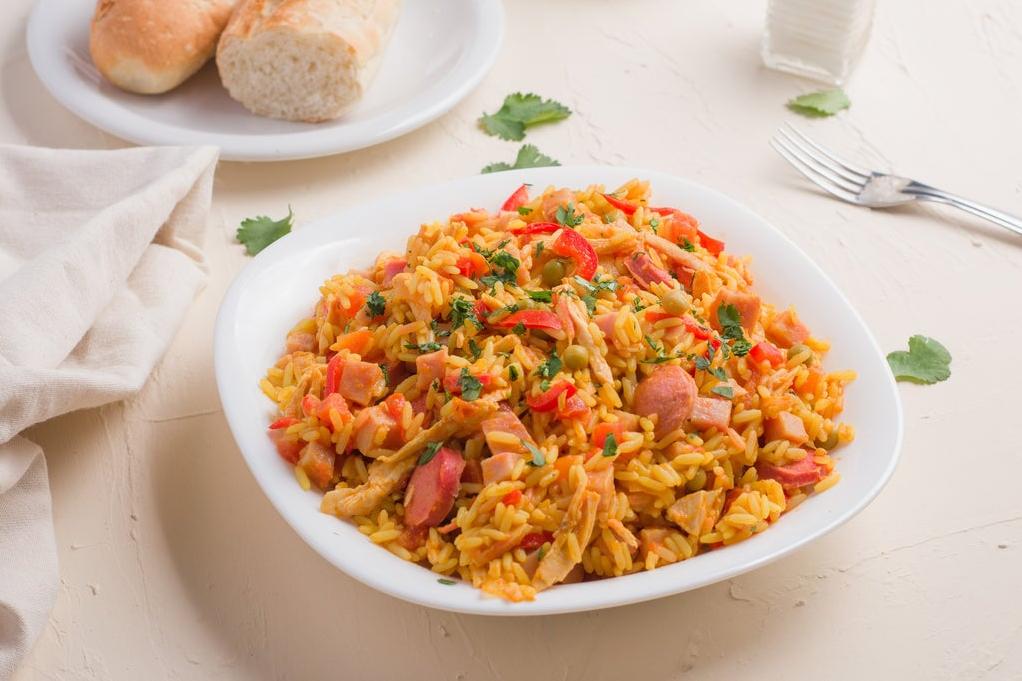  One bite of Arroz a La Valenciana will transport you to the sunny streets of Valencia.