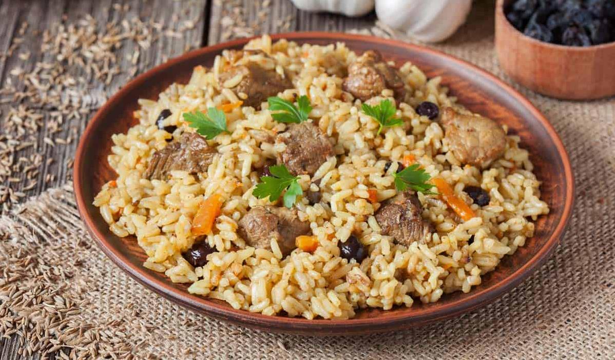  Perfectly cooked rice with savory pork and olives.