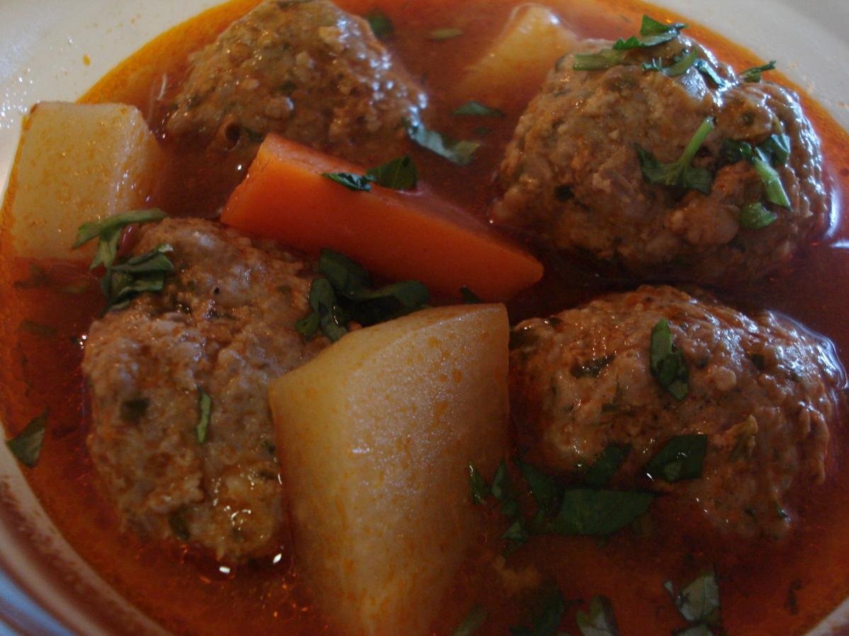  Savory meatballs swimming in a pool of deliciously spiced broth