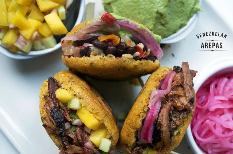  Smoky and charred arepas fresh off the grill.
