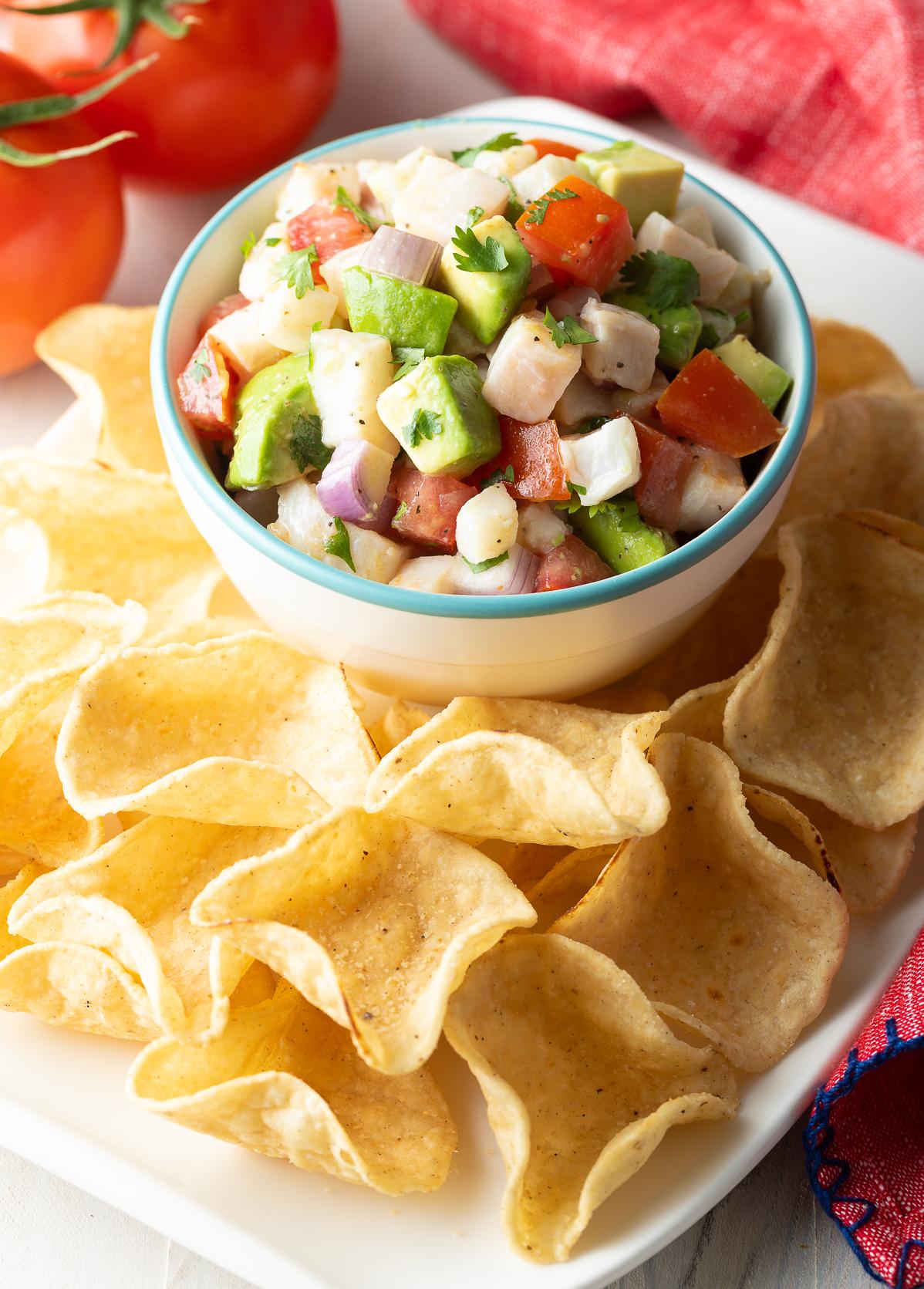  Tangy lime juice and spicy peppers add zing to Ceviche De Corvina.