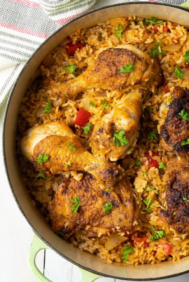  The tender chicken and fluffy rice are perfectly complemented by the array of vegetables in the dish.