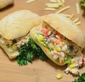  This sandwich packs a punch of flavor and texture with crunchy vegetables and juicy shredded chicken.