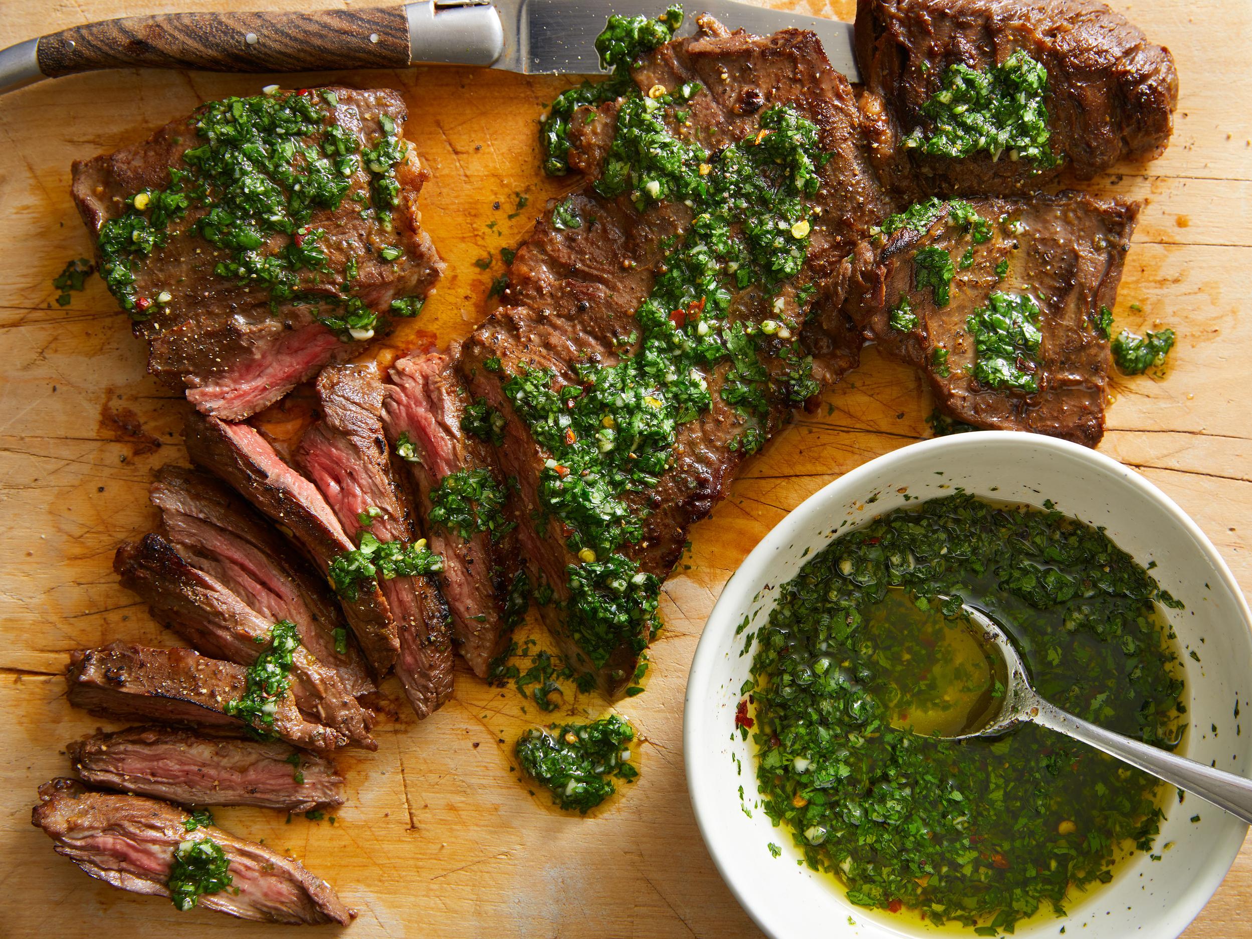  Vibrant green chimichurri sauce adds a pop of color to a rustic dish.